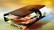 filofax personal organiser bursting with extra paper